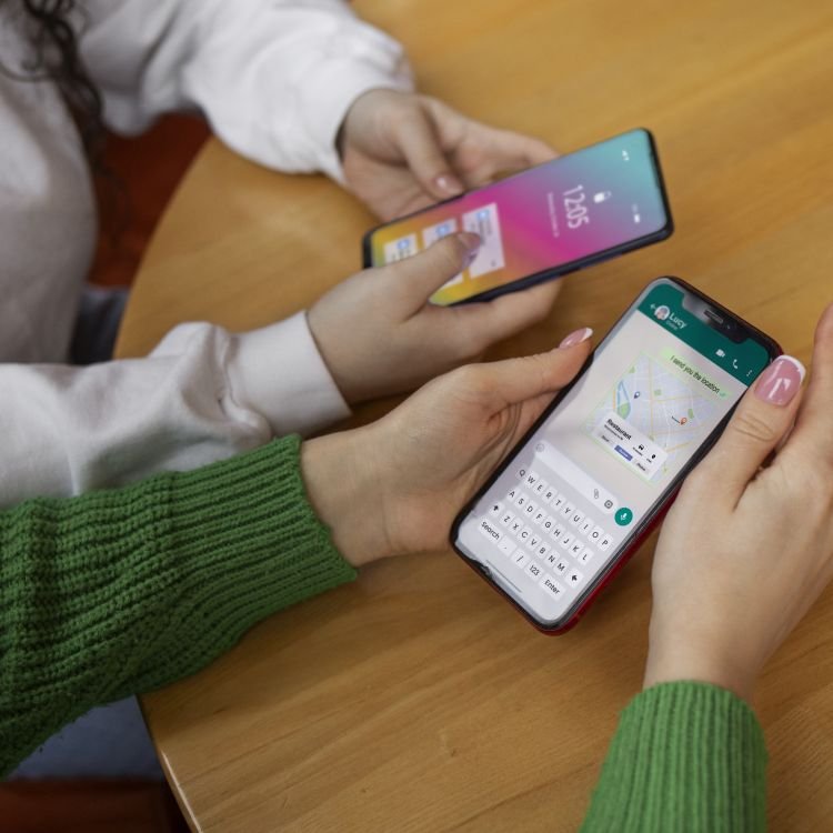 high-angle-friends-holding-smartphones